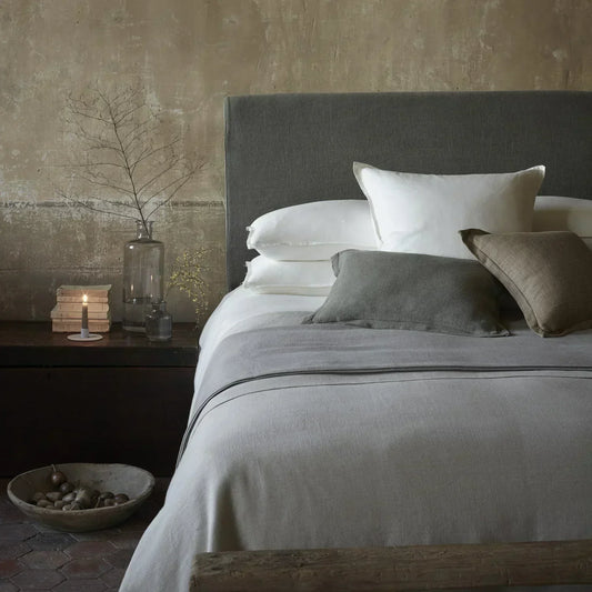 Bed dressed and styled for interior