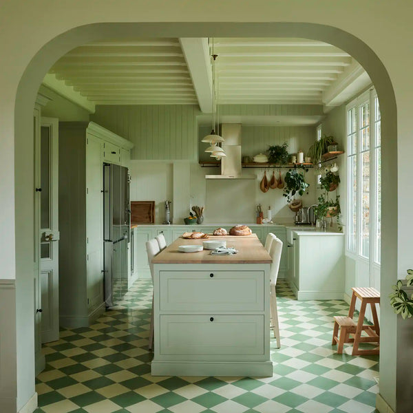 Henley kitchen with Sage painted cabinetry, central island and green and white chequerboard flooring.