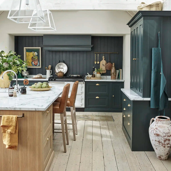 Henley kitchen with dark Constable Green painted cabinetry, oak island, marble worktops and range cooker.