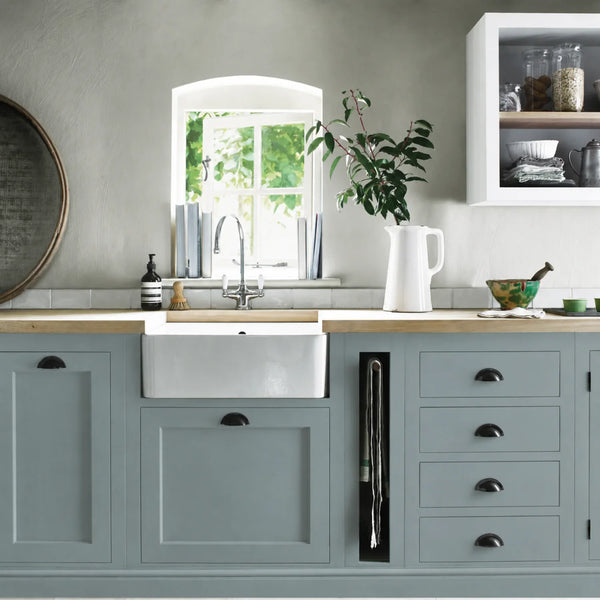Aqua Blue painted Henley kitchen cabinetry with oak worktops and a white farmhouse sink.
