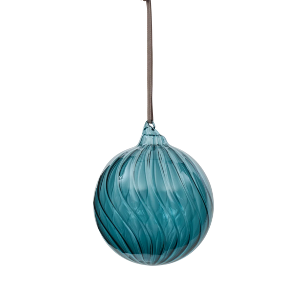 A teal blue glass Christmas ornament with a swirled, ribbed texture, hanging from a thin brown ribbon against a solid white background.