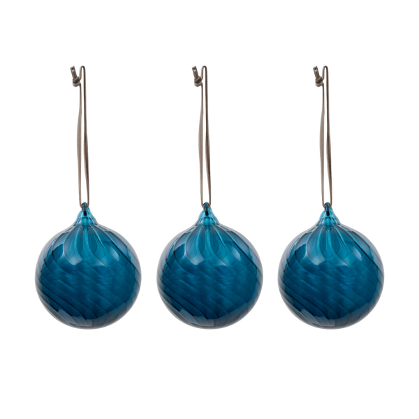 Three blue faceted glass Christmas ornaments with silver hanging loops, arranged side by side on a plain white background.