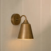 Belgrave industrial style brushed brass wall light, light on