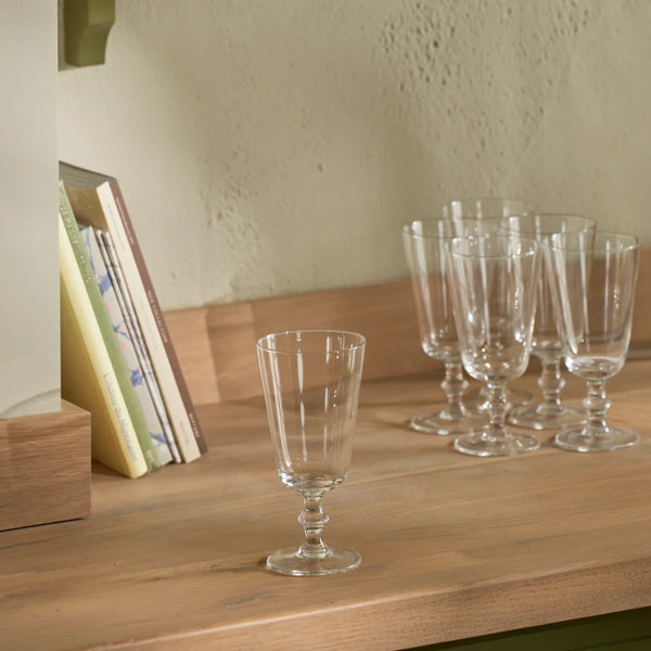 Greenwich wine glasses on wooden ledge