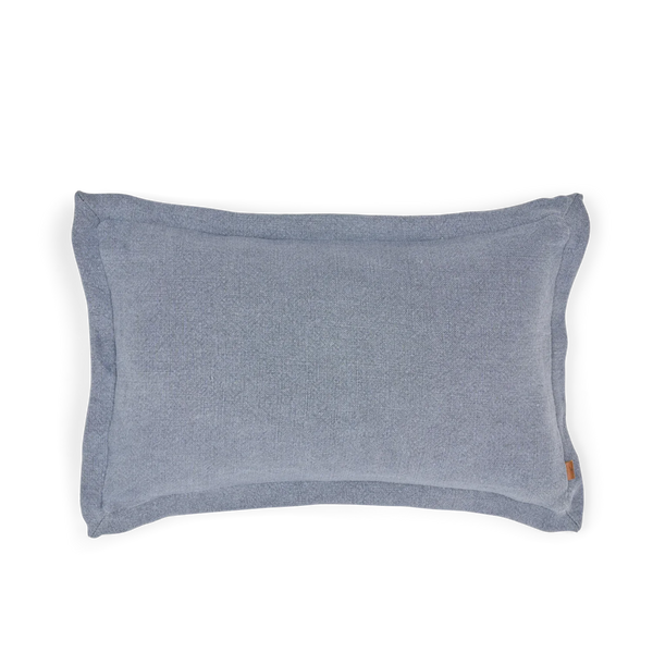 A rectangular blue-gray pillow with a soft, textured fabric cover, shown from a top-down view on a solid white background.