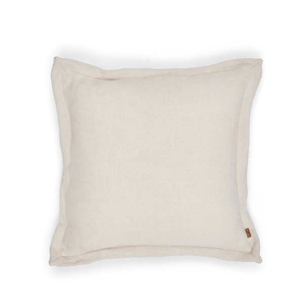 A square off-white linen throw pillow with piped edges and a small brown fabric tag on the bottom right, shown on a clean white background.