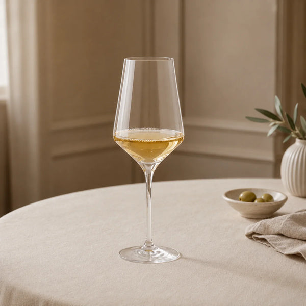 Hoxton White Wine Glass on table with linen tablecloth and olives