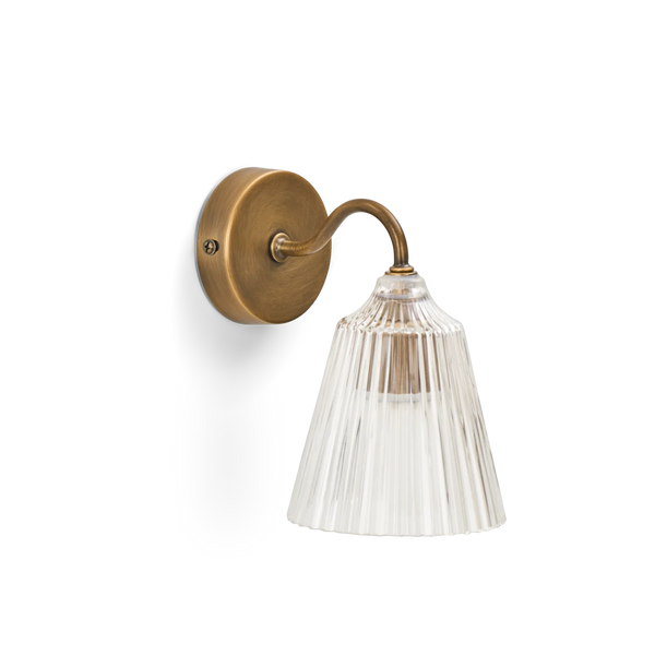 Lennox wall light with brushed brass base and glass shade on white background.