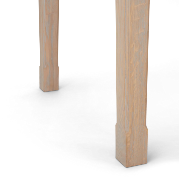 Close-up of a light natural wood table legs on a plain white background.