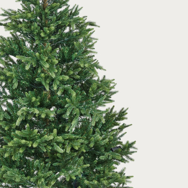 Realistic artificial Christmas tree on a white background