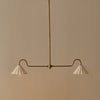 Polperro brushed antique brass pendant bar light with scalloped ceramic lampshades, lights on