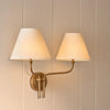 Regency Wall light, double light in brass with linen shades, lights on