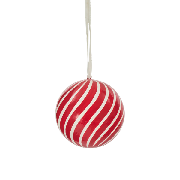 A spherical Christmas ornament with diagonal red and white stripes, hanging from a white string against a plain white background.