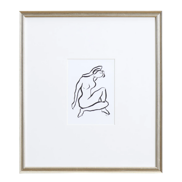 A framed minimalist black line art print of a seated figure on a white background