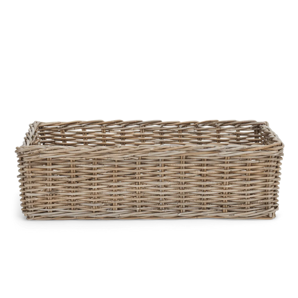 A rectangular woven wicker basket with a natural light brown and beige tone, shown from a front-facing perspective on a solid white background.