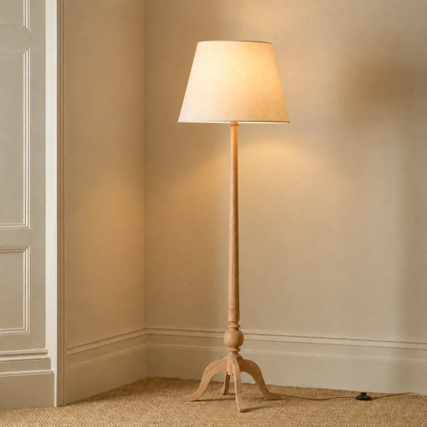Thornbury Floor Lamp in natural oak with linen shade, lights on