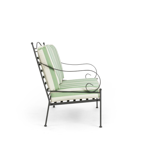 Wrought iron garden sofa green and white striped cushions on a white background