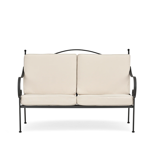 A two-seat outdoor garden sofa with cream cushions and a black metal frame, shown against a plain white background.