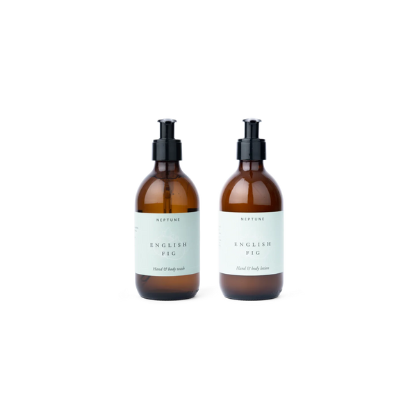 Two amber glass pump bottles containing Neptune English Fig Hand and Body Wash and Hand and Body Lotion on a plain white background.