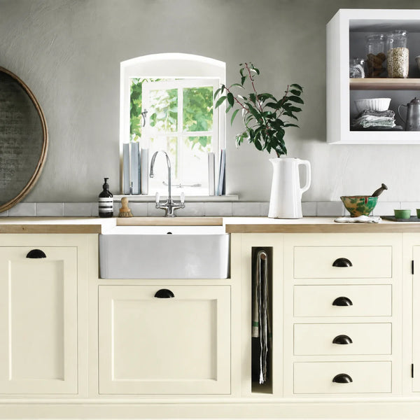 Orkney White painted Henley kitchen cabinetry with oak worktops and a white farmhouse sink.