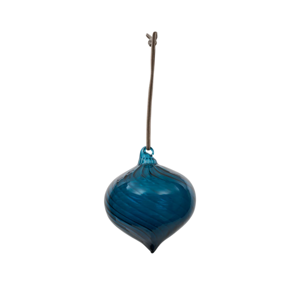 A hand-blown glass ornament in a deep teal-blue color with horizontal swirls, featuring a brown hanging stem at the top, shown against a plain white background.