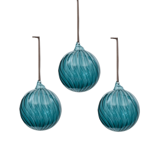 Three teal-blue glass hanging ornaments with a swirled ribbed texture, suspended by thin dark cords against a plain white background.