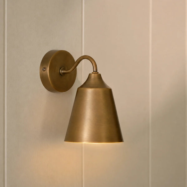 Belgrave industrial style brushed brass wall light, light on