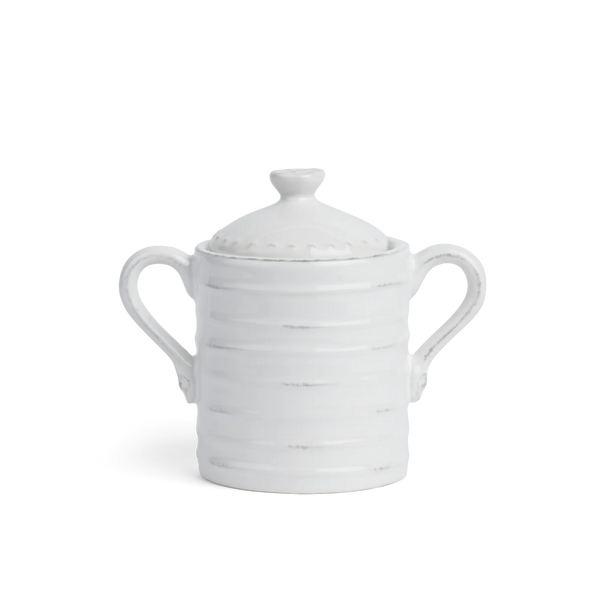 A white ceramic lidded sugar bowl with two side handles and subtle distressed gray horizontal lines, shown on a clean white background.