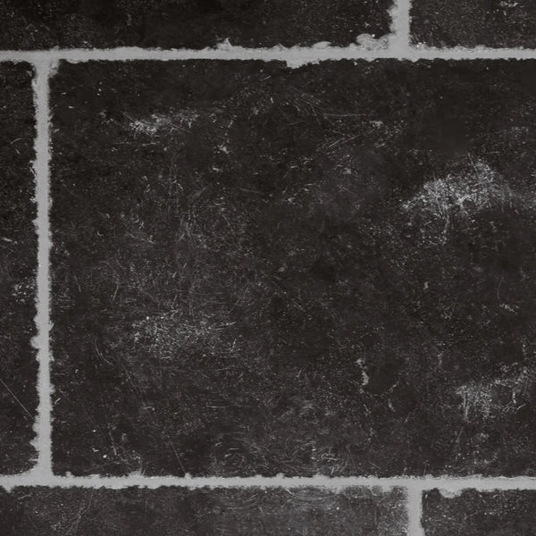 Dark charcoal gray stone tile texture with light gray grout lines between rectangular tiles.