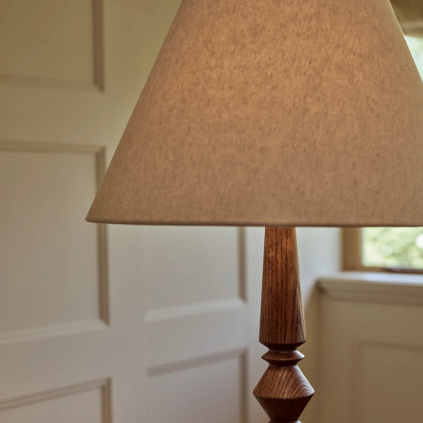 Chalford darkened oak floor lamp in upscale living room with cream paneled walls