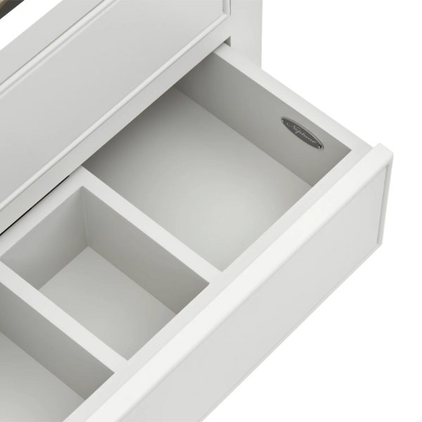 Close-up of a white drawer with one pull-out compartment open, showing the interior and a small oval metal pull tab.