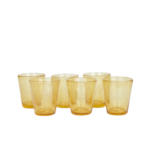 Six small amber-colored drinking glasses with a textured, bubbly glass finish, arranged in two rows on a plain white background.