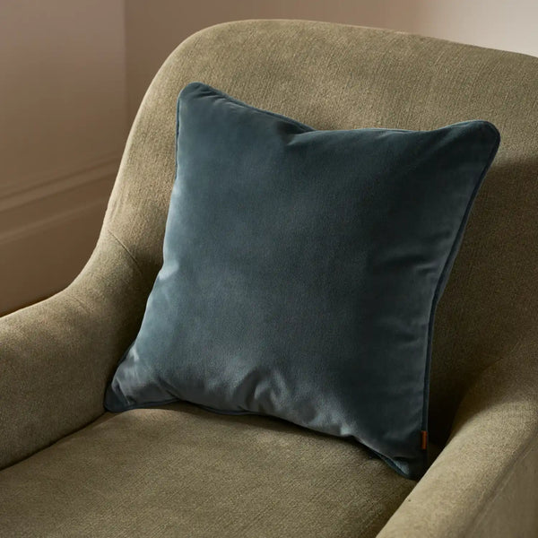 Blue Velvet Scatter Cushion on armchair
