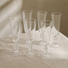 Greenwich Champagne Flutes on table with linen tablecloth