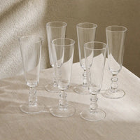 Greenwich Champagne Flutes on table with linen tablecloth