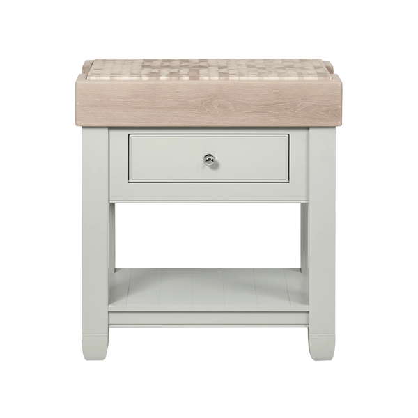A butchers block with a light grey painted frame, a single drawer with a round silver knob, and an open lower shelf. The top surface is a removable end grain oak chopping board with a natural wood edge visible along the front.