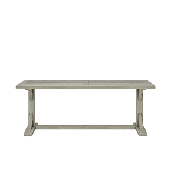 A rustic-style wooden dining table with a weathered gray finish, featuring a slatted top and trestle-style legs, shown against a plain white background.