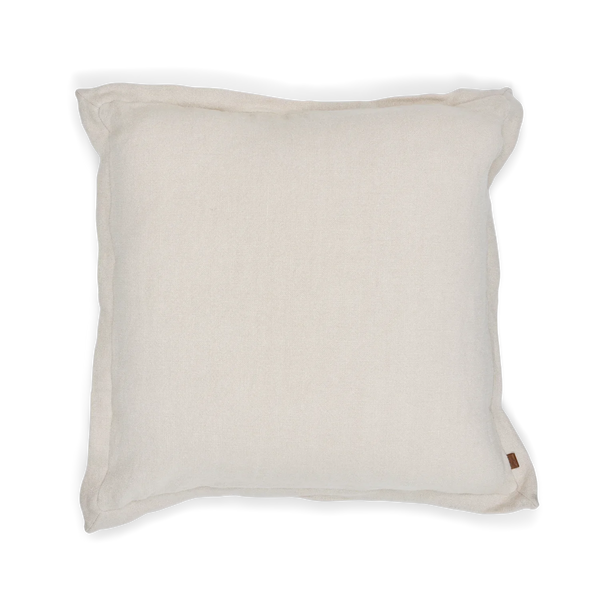 A square off-white linen throw pillow with a small brown leather brand tag on the bottom right corner, shown against a plain white background.