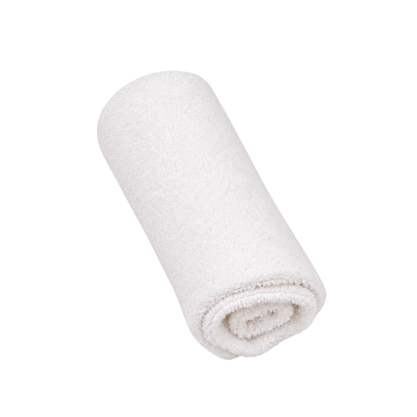 A rolled white cotton towel with a soft, plush texture, isolated on a solid white background.