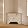 Henley 3ft 6 Corner AV Cabinet in Silver Birch with oak top, styled in a softly lit neutral room corner.