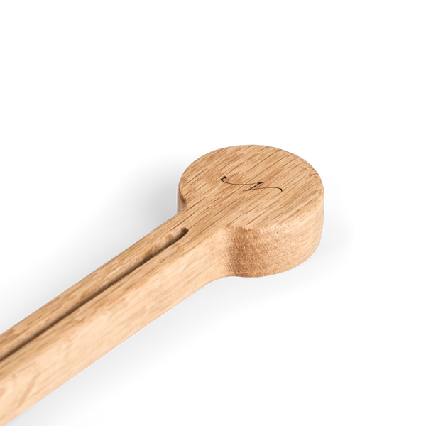 Orford engraved wooden coffee scoop against white background