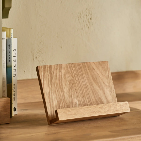Orford white oak wooden cookbook stand, displayed on wooden counter