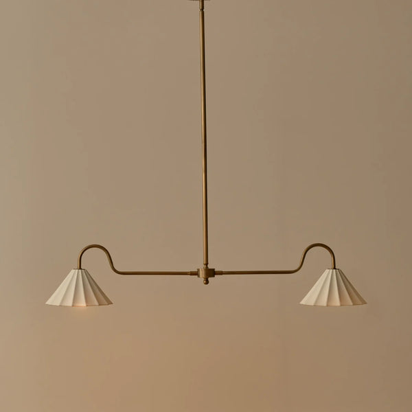 Polperro brushed antique brass pendant bar light with scalloped ceramic lampshades, lights on