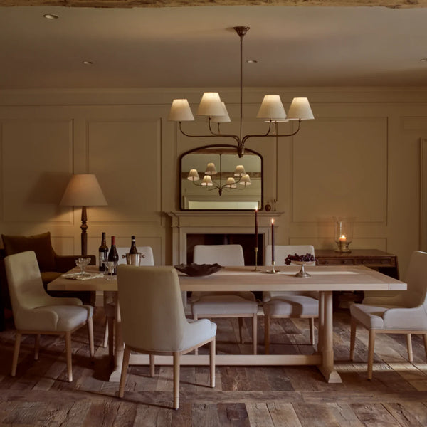 Regency six lamp large pendant light in brass shown in elegant dining room with oak wooden dining table, upholstered oak chairs, fireplace