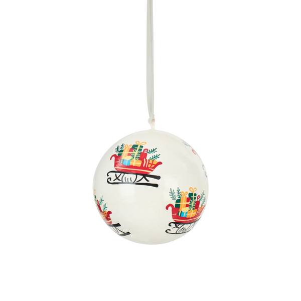 A white Christmas hanging ornament shaped like a ball, decorated with colorful illustrations of red sleighs carrying gifts, suspended by a thin white string against a plain white background.
