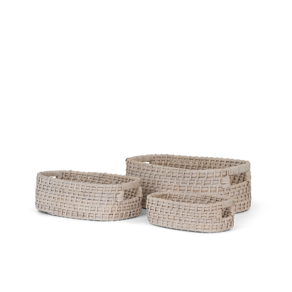 Three oval woven storage baskets in a nested set, made from natural light beige material with small side handles, shown on a plain white background.