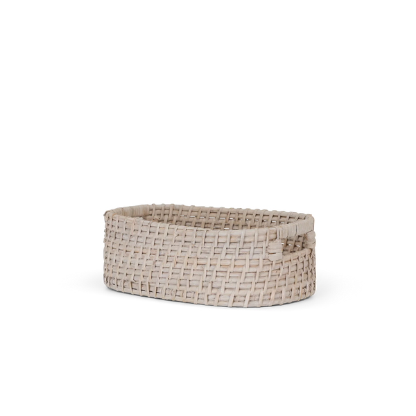 A small oval woven basket made from light natural fibers, featuring integrated side handles, shown on a plain white background.