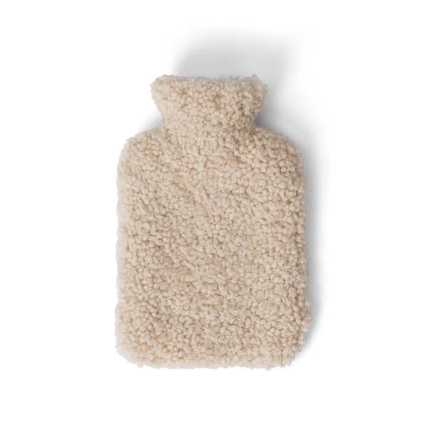 A beige sheepskin hot water bottle cover on a white background.