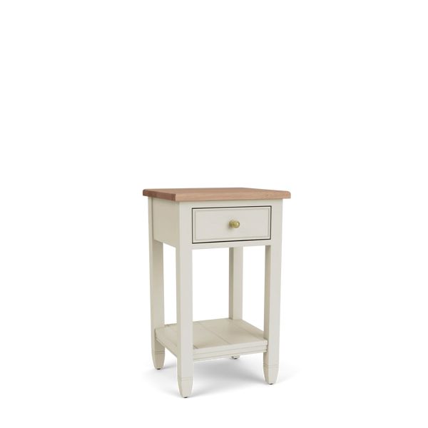 Angled view of the Chichester open bedside cabinet, with a natural oak top, painted timber frame, single drawer, open lower shelf and traditional brass handle.