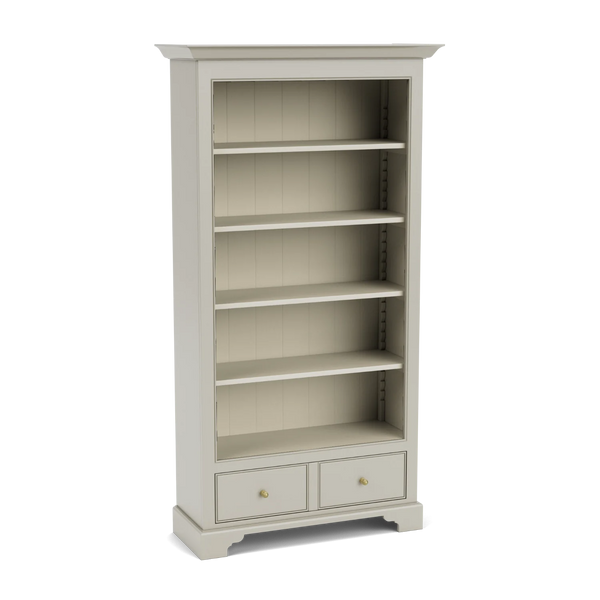 Chichester tall bookcase with open shelving and lower drawer, shown from an angled view.